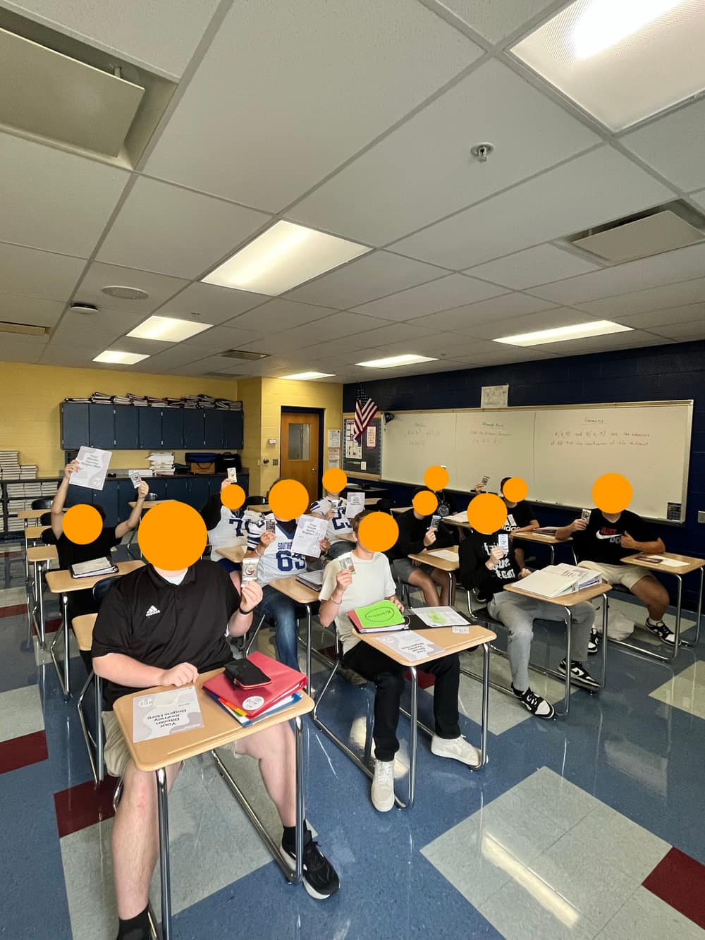Students in a classroom holding Bitcoin Education Foundation materials