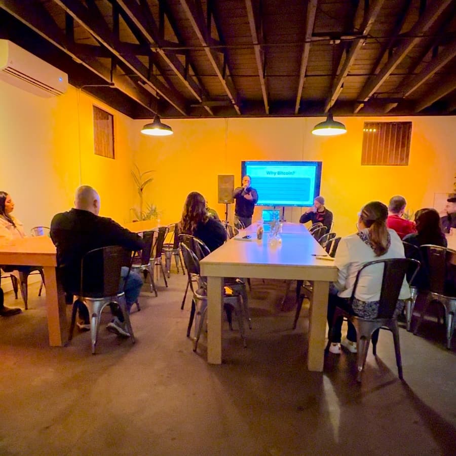Adults at a community 'Why Bitcoin?' presentation